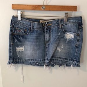 Hollister | Destroyed denim mini skirt.